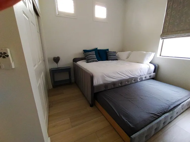 Second bedroom with twin mattress trundle shown