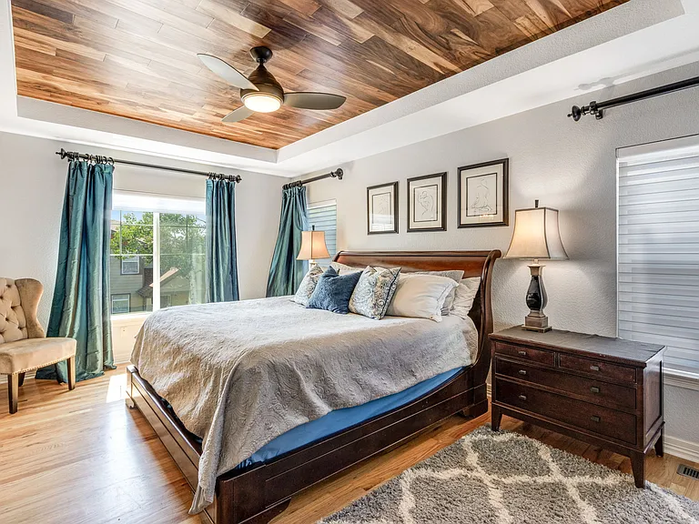 Master suite with king bed, hardwood flooring, Acacia wood ceiling, Restoration Hardware furniture