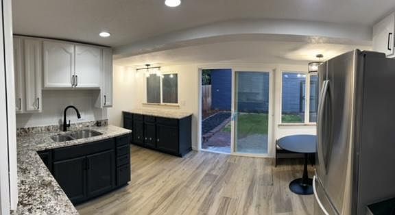 Kitchen with tons of natural light, dishwasher, bonus prep space/bar, plenty of storage & breakfast nook