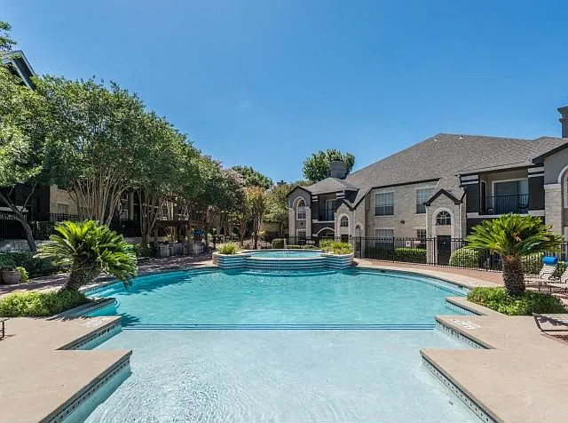 Pool with waterfall feature in courtyard