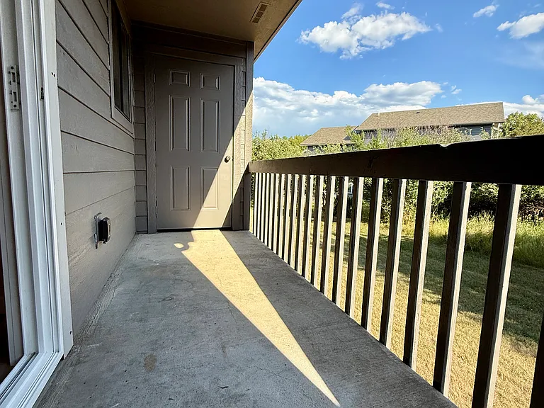 Balcony off dining area with exterior storage