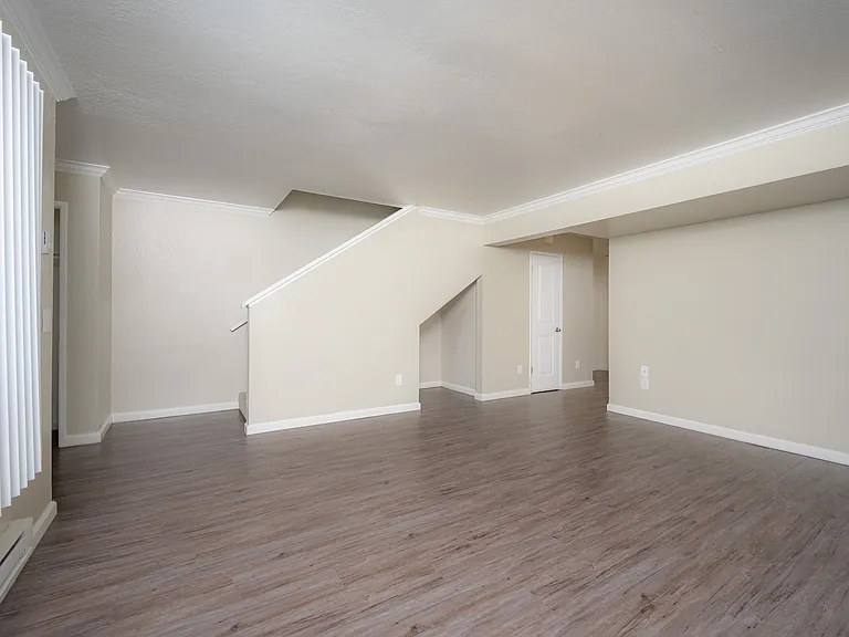 Explore this spacious and modern living room, perfect for relaxation and entertainment.