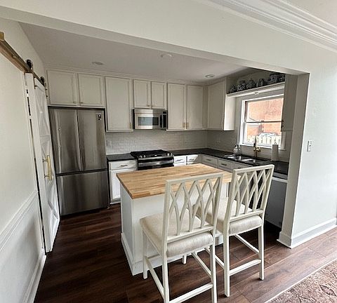 Updated kitchen with tons of storage space and moveable kitchen island.