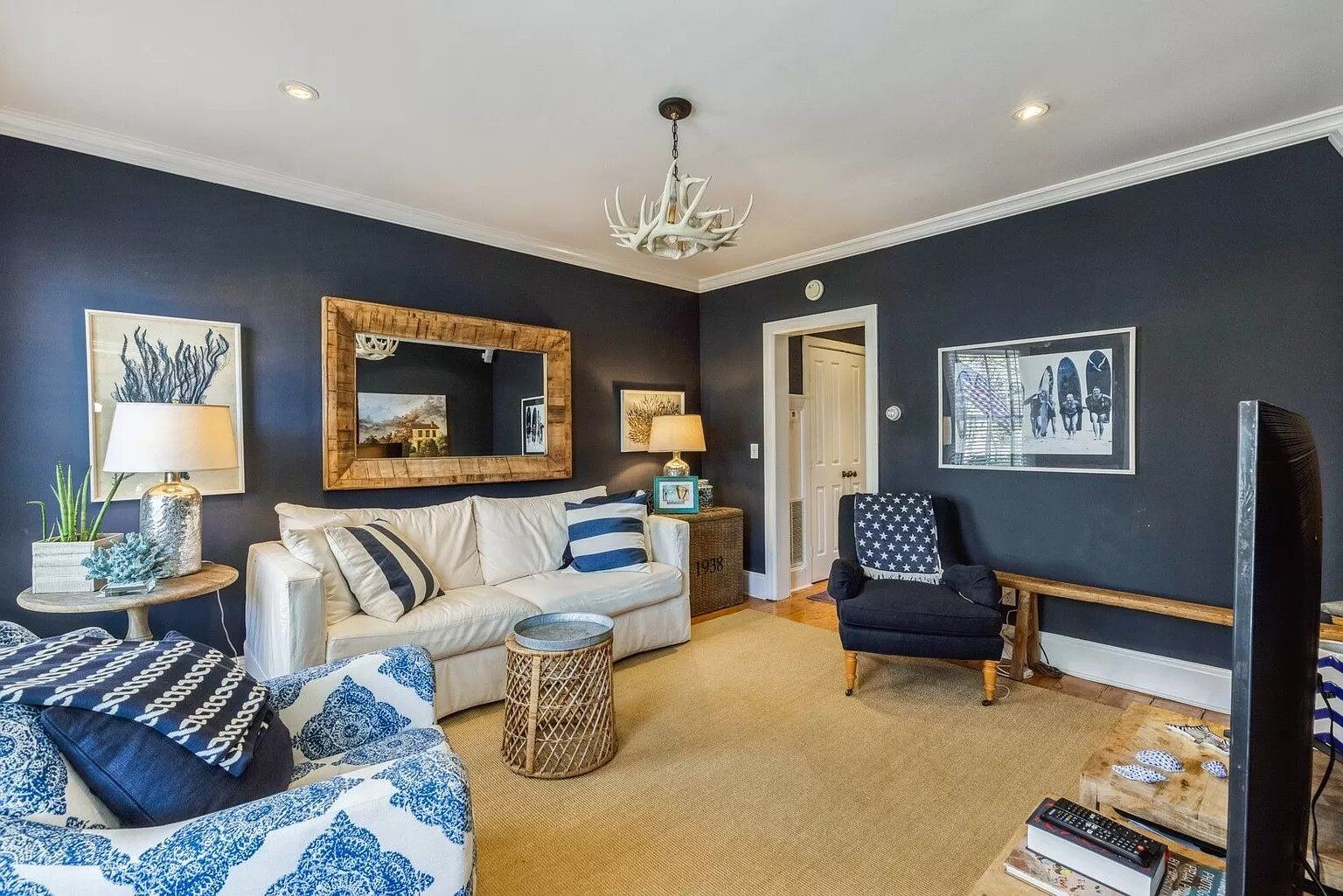  well lit and sunny living room with 55 inch SMART TV. Pull out sleeper sofa/couch