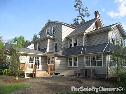 Front Entrance
						:
						The curved door top is reflected in the front-porch roof line