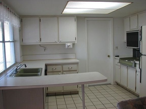 Kitchen with pass thru to patio