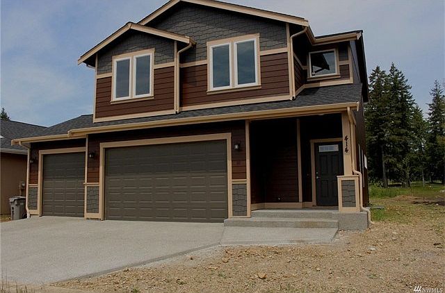 Attractive two story with 3 car garage.  Complete with laminate flooring throughout the main level, painted trim, granite slab kitchen counters, stainless appliances, and master with double sinks.