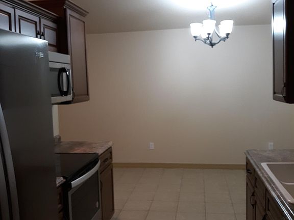 tiled floors in kitchen and dining area
