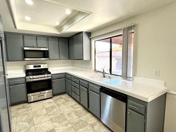 Appliances stainless steel, stove microwave and dishwasher. Kitchen cabinets newly painted and refinished. New Counter tops.