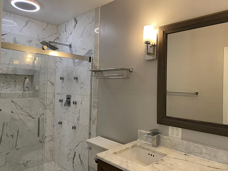 Marble master bath, dual sinks, rain shower.