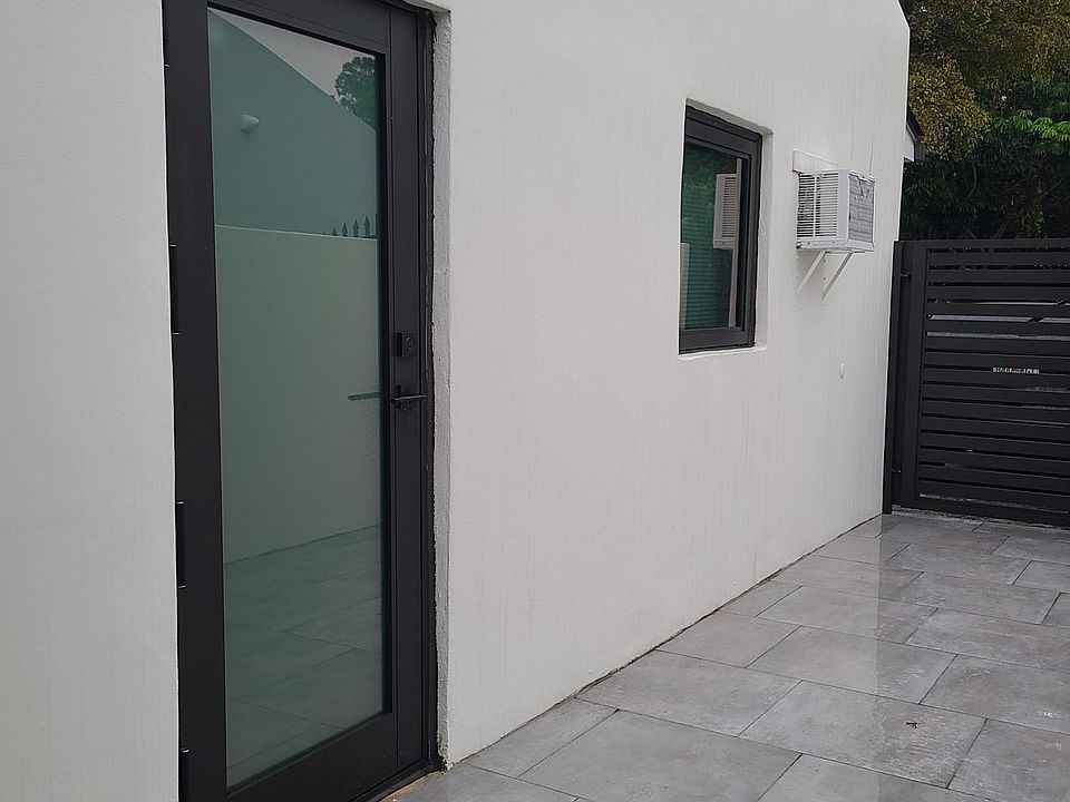 Private entrance with a new impacted door and windown.