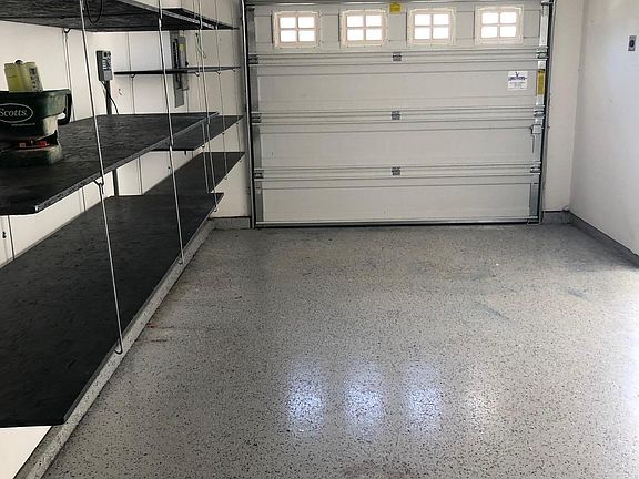 3rd bay of the garage. shelves and work bench included.