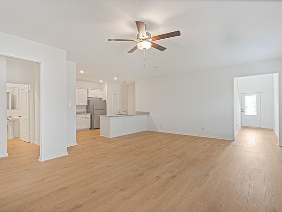 A foyer leads to the family room and adjoining kitchen