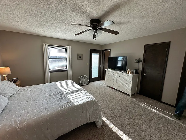 The spacious master bedroom features a private en suite, creating a comfortable retreat. A door from the bedroom opens directly onto a private deck, offering the perfect spot to enjoy your morning coffee or unwind in the evening in complete privacy.