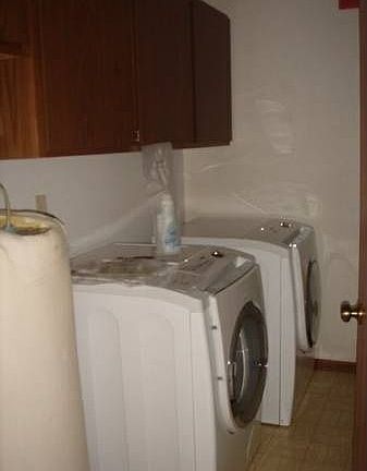 Laundry room with front load washer and dryer