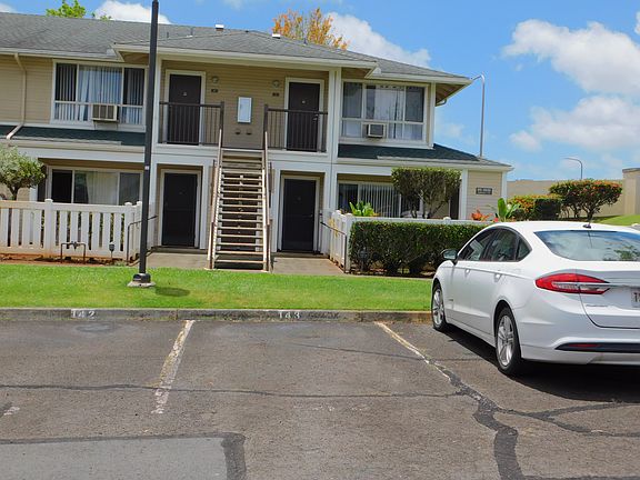 One assigned uncovered parking stall in front of the upstairs end unit.