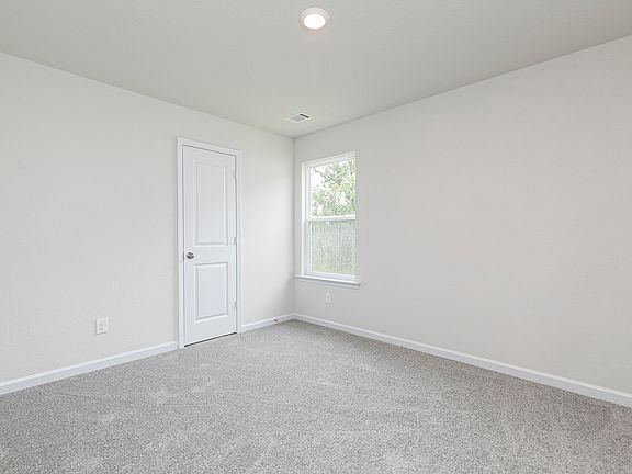 The second bedroom includes a closet, window, and carpet