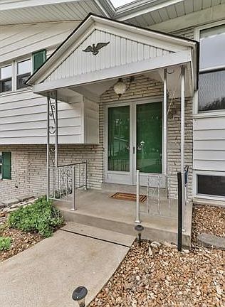 Double door entry with covered porch