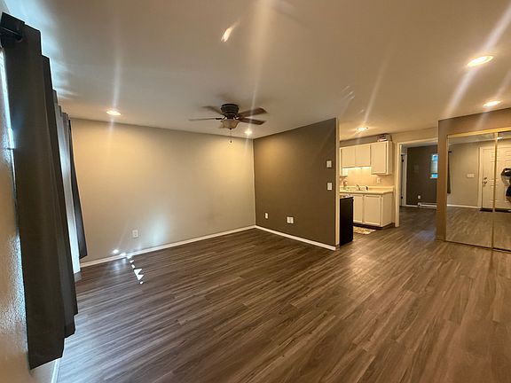 living room looking into kitchen and dining area