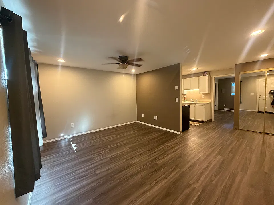 living room looking into kitchen and dining area