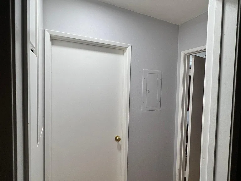 Please note: Pre-renovation photo shown for layout reference. Brand-new flooring has since been installed.