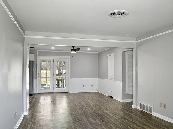 Breakfast/dining room with French doors to the backyard.