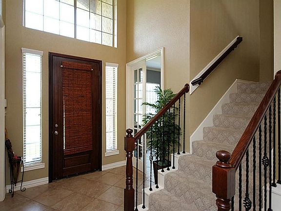 Entry with with travertine marble tile.