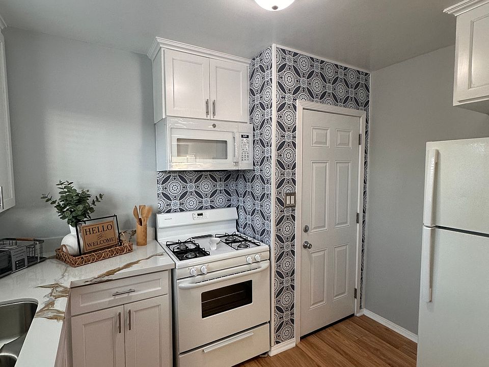 Kitchen with rear entry door.