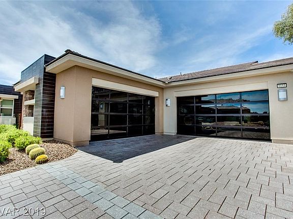 Tiled driveway with glass black-out 4-car garage doors from the outside and completely see through from the inside!