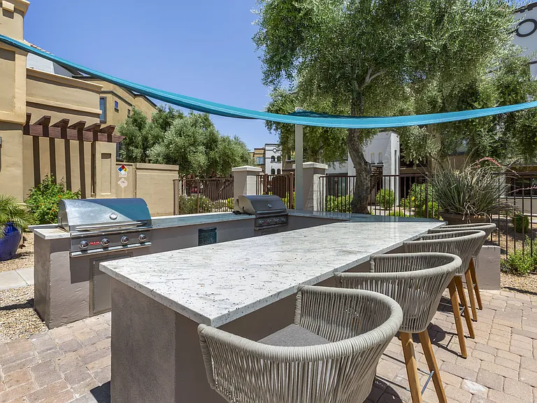 Poolside BBQ area at Trevi Apartment Homes