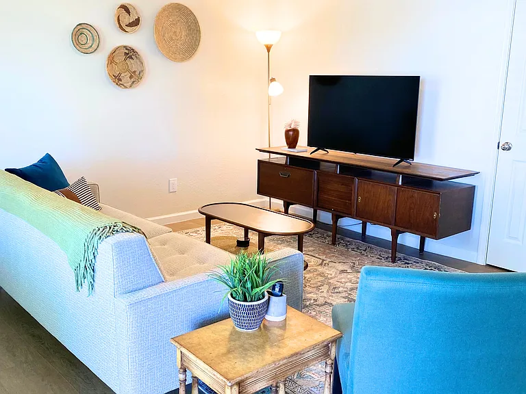 Entertainment center with family games inside and a smart tv.