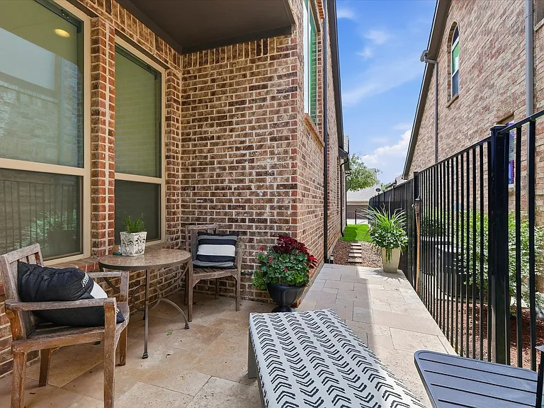 Private patio space with Elegant Stone Pavers, leads to additional backyard space