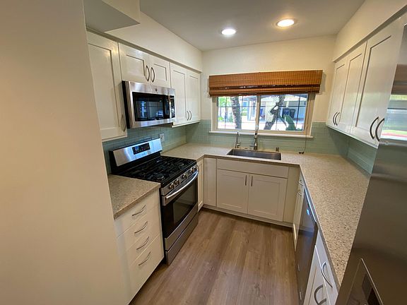 Kitchen with stainless appliances and quartz countertops