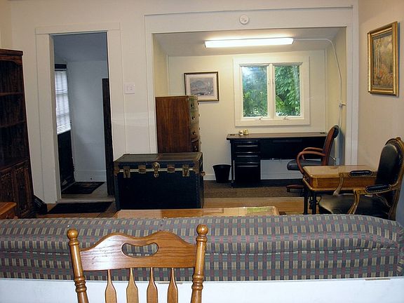 Main area open with vaulted ceilings : Lighting just updated. Front door walks into living, dining a