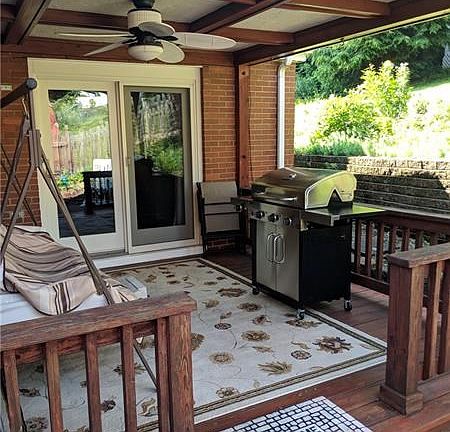 Covered rear patio with furniture.
