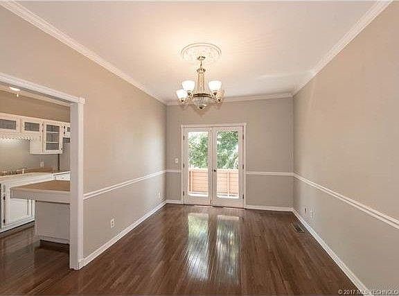 dining room can accommodate 10 foot table, nice deck off french doors.