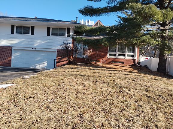 Front view of house, showing tuck under 2-car garage