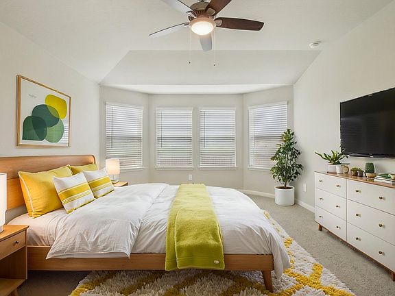 Virtually staged primary suite in the Preston floorplan at a Meritage Homes community.