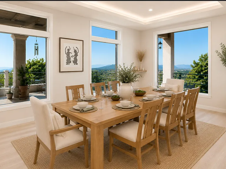 Open-concept dining area seamlessly connects to the living room, creating an ideal space for entertaining. Surrounded by natural light and scenic views, it comfortably accommodates family gatherings while enhancing the home's spacious, flowing design.
