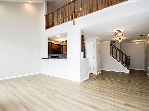 living area with loft and kitchen