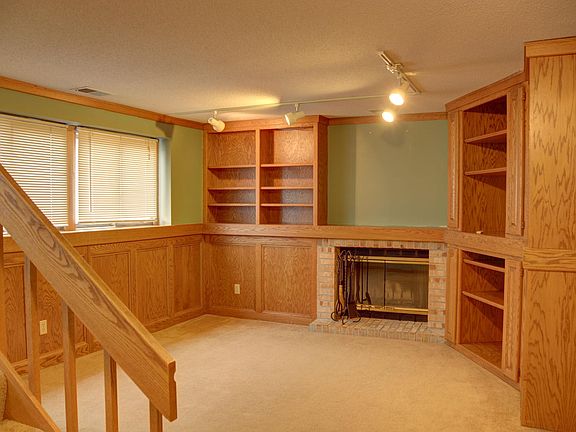 The family room has a wood burning fireplace and lots of built-in cabinets. Enjoy your movie nights or watch sports in the comfort of your family room. It comes with dimmable track light.