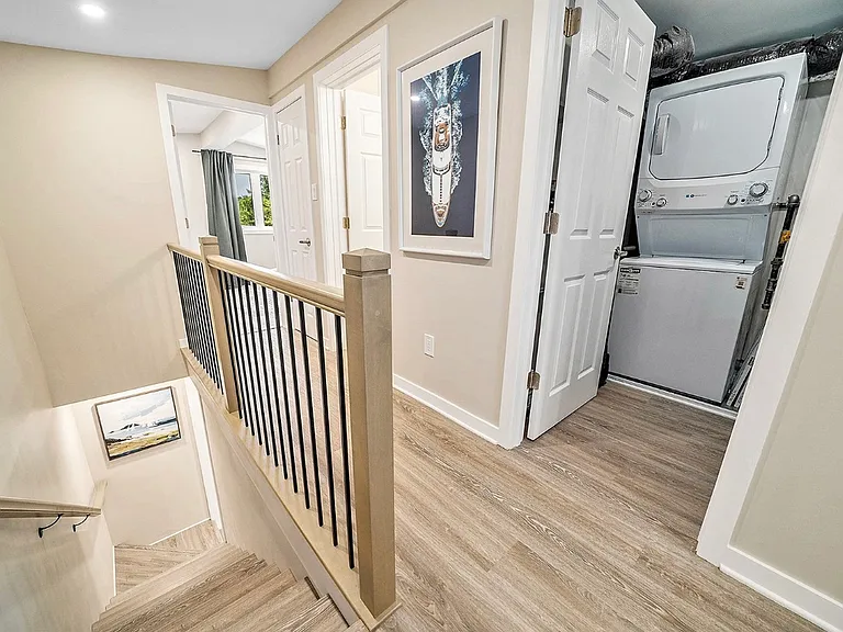 Hallway leading to laundry and bathroom in an Ottawa midterm suite.