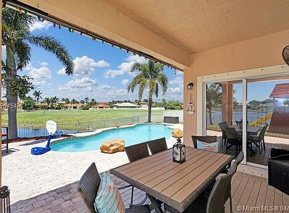 WATCH ALL THE KIDS PLAY IN THE POOL WHILE YOU ENTERTAIN YOUR GUESTS OR PICNIC AT THE TABLE!