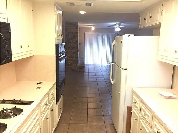 Galley kitchen, part of the large living space.