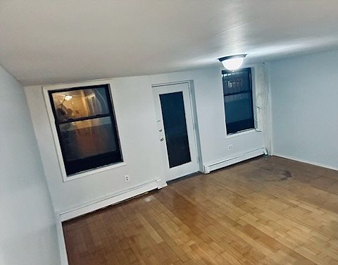 Living space at night, door to back yard.