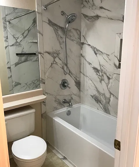 Shower and tub that attaches to bedroom 1.