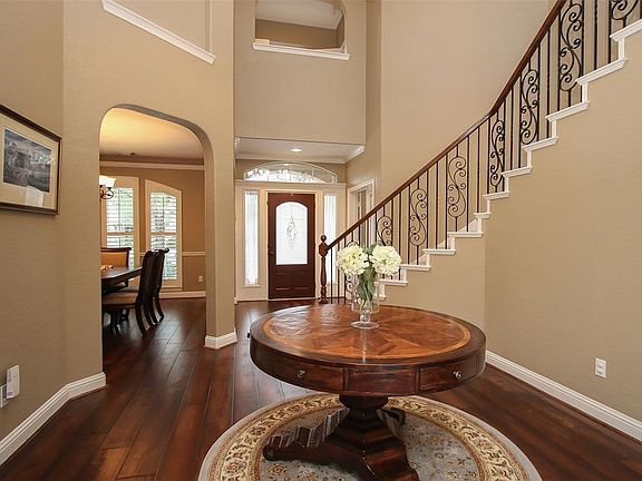View looking towards the front door with formal dining to the left and study to the right.