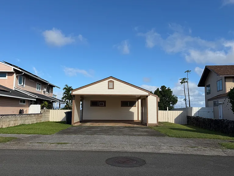 Front of home, fenced yard, 2 car carport with storage, driveway with parking for 2 additional cars, and street parking is also available. Popular, desirable area of Mililani with sense of community.