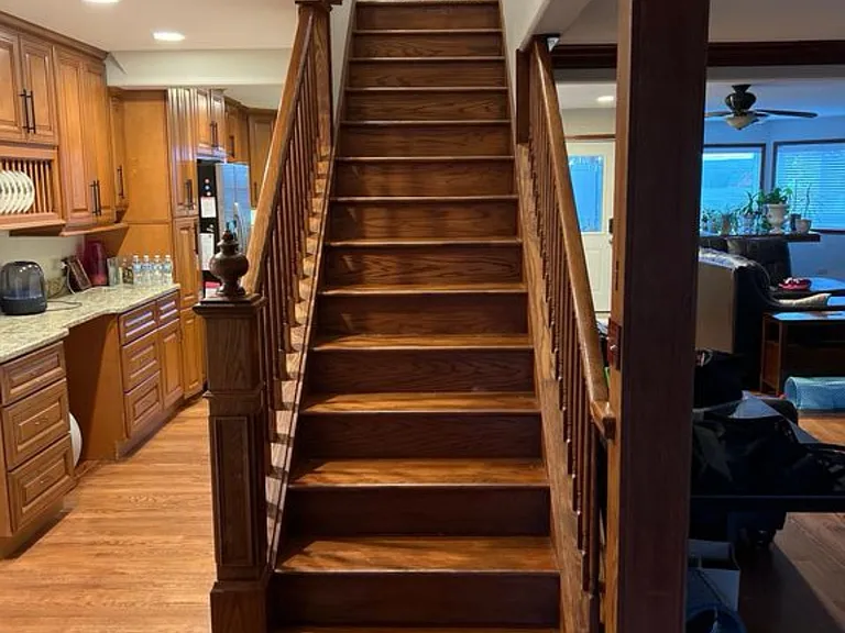Grand staircase going up to second level.