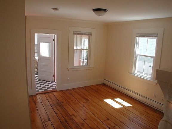 Living Room with view towards kitchen and entryway